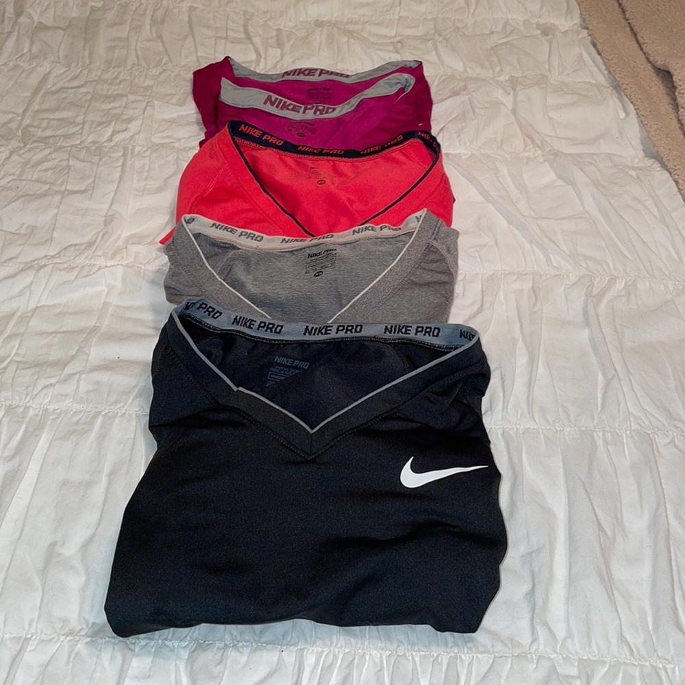 Nike Pro womenswear athletic tops.